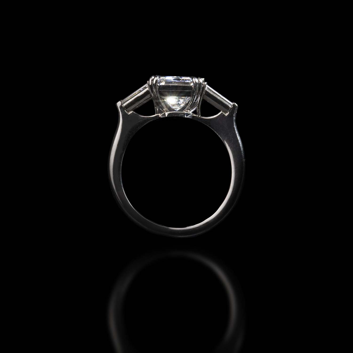 The Moon Ocean Rings in Platinum with Emerald Centre Stone Alternate shot 2