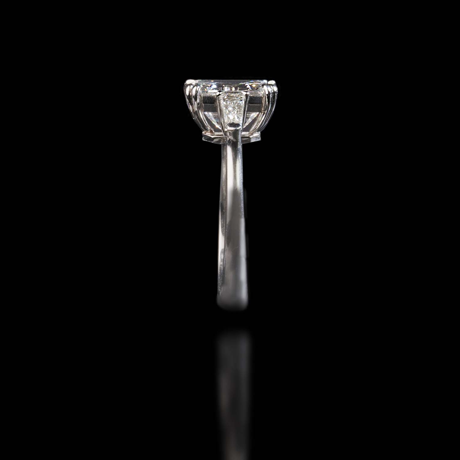 The Moon Ocean Rings in Platinum with Emerald Centre Stone Alternate shot 3